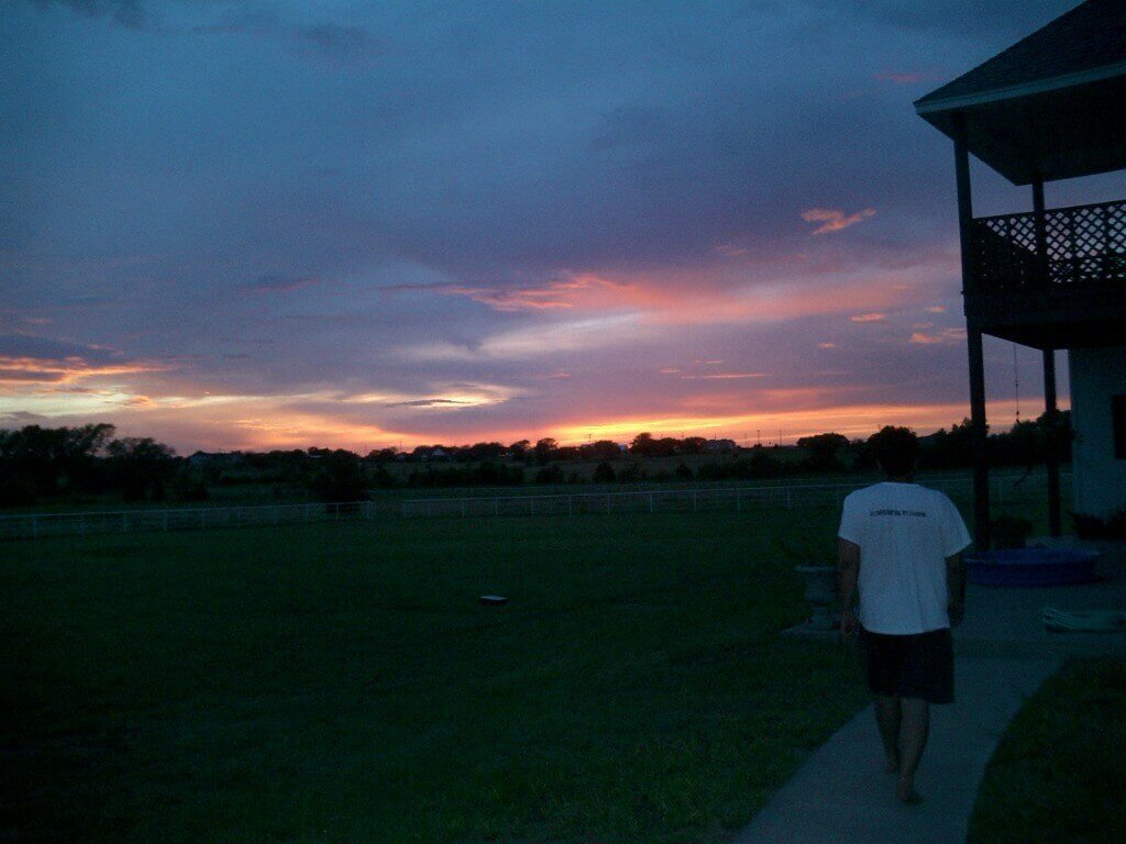 Walking toward sunset on a Texas ranch at dusk